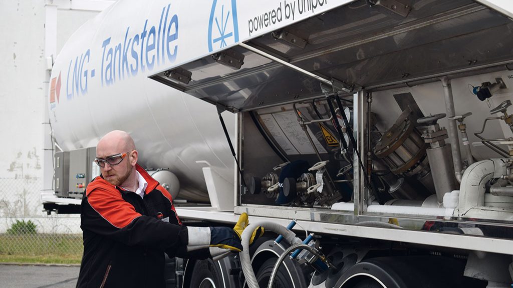 LNG filling station attendant with protective goggles and gloves