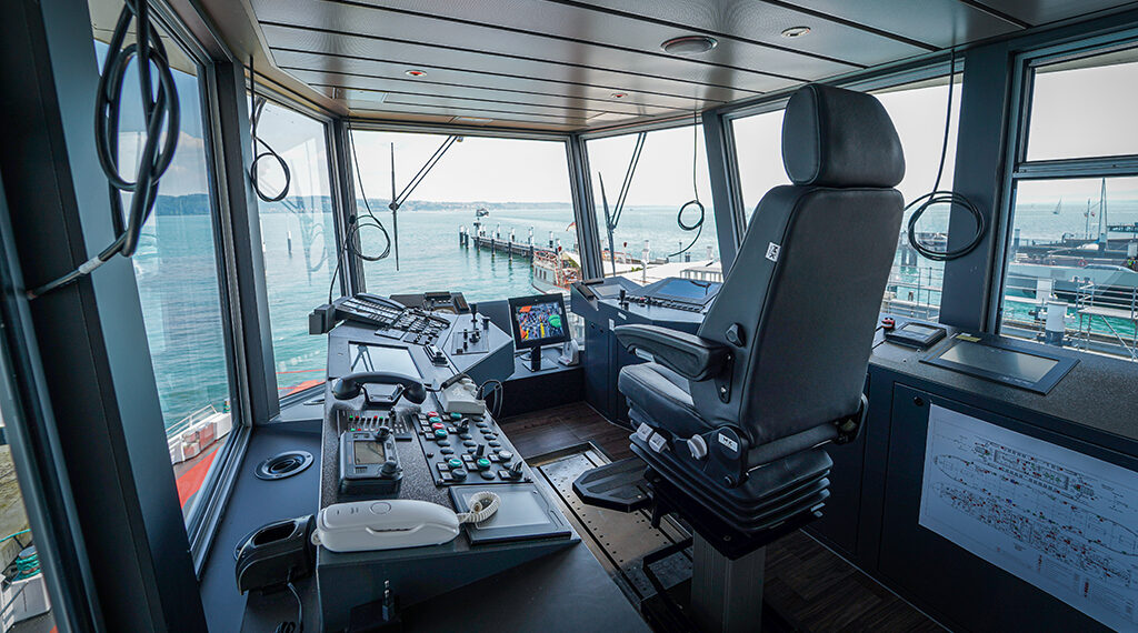 The modern command bridge of the inland ferry with gas propulsion